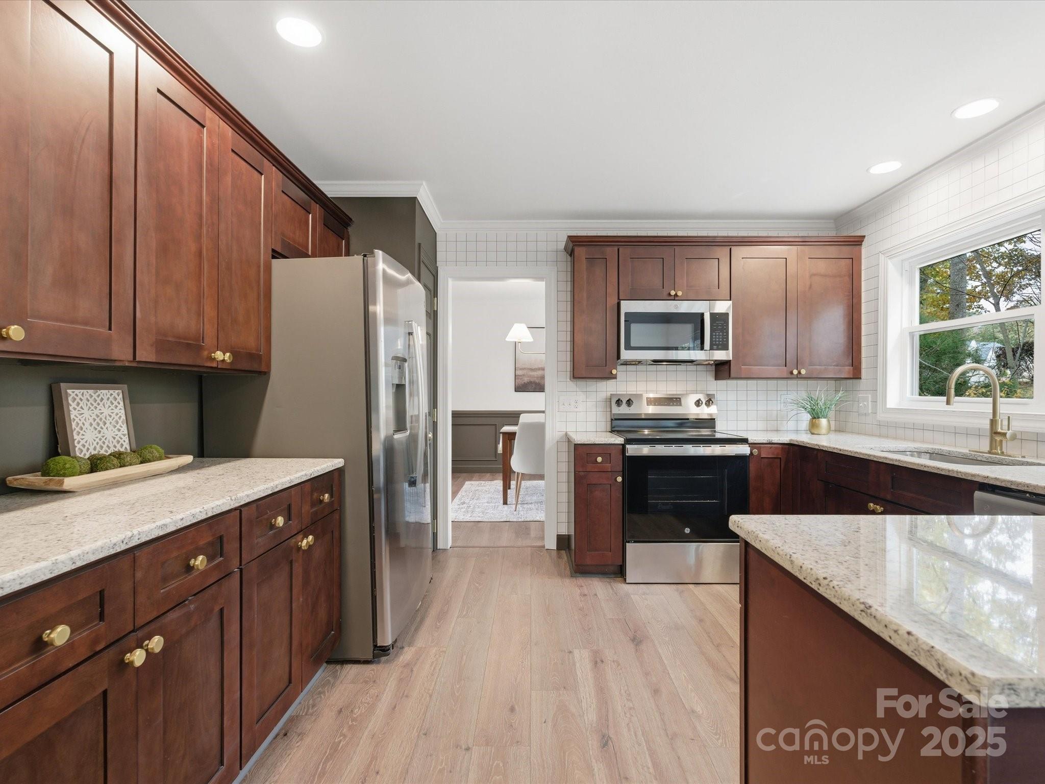 3909 Brownes Ferry Road Charlotte, NC 28269 - Photo 9 of 47 a kitchen with a sink stove and refrigerator