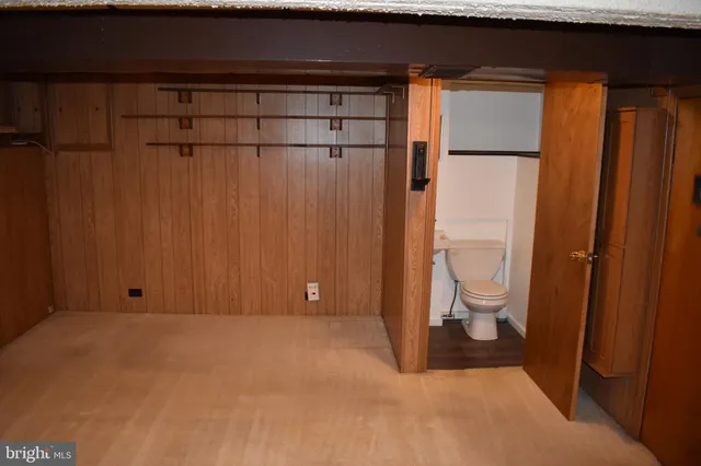 a view of a garage with furniture and a fireplace