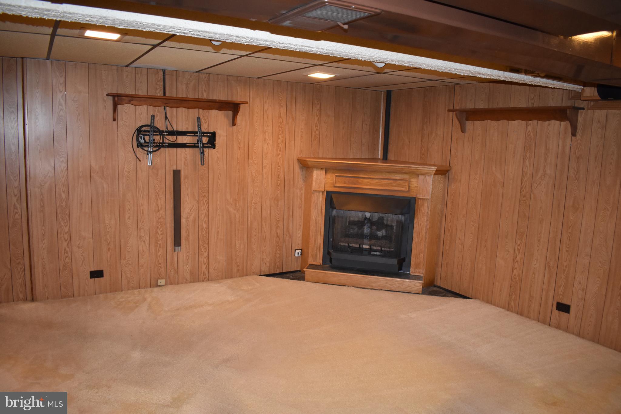 409 Walnut Street West Reading, PA 19611 - Photo 14 of 24 a view of a garage with furniture and a fireplace
