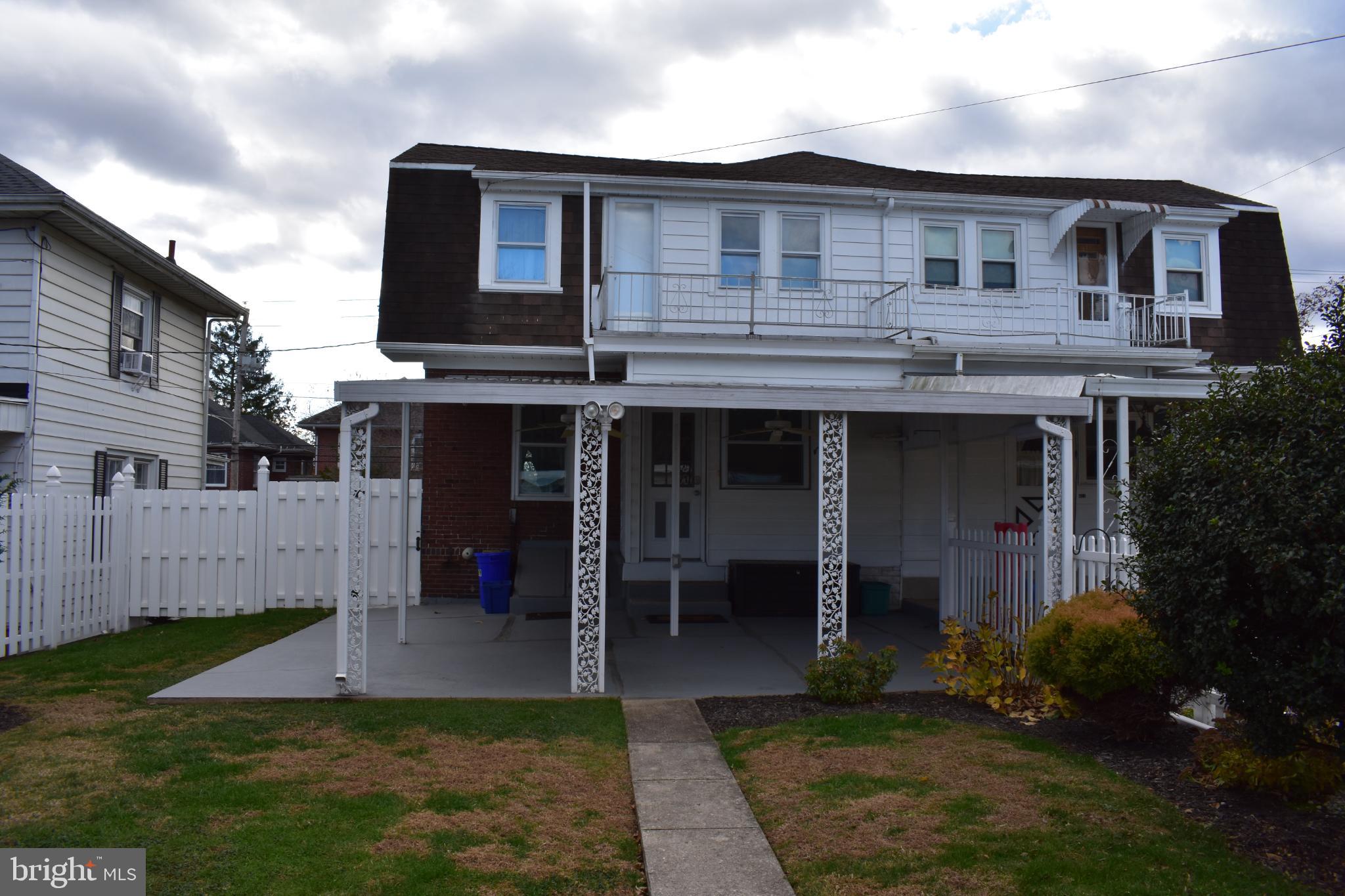 409 Walnut Street West Reading, PA 19611 - Photo 24 of 24 a view of a house with a yard plants and large tree