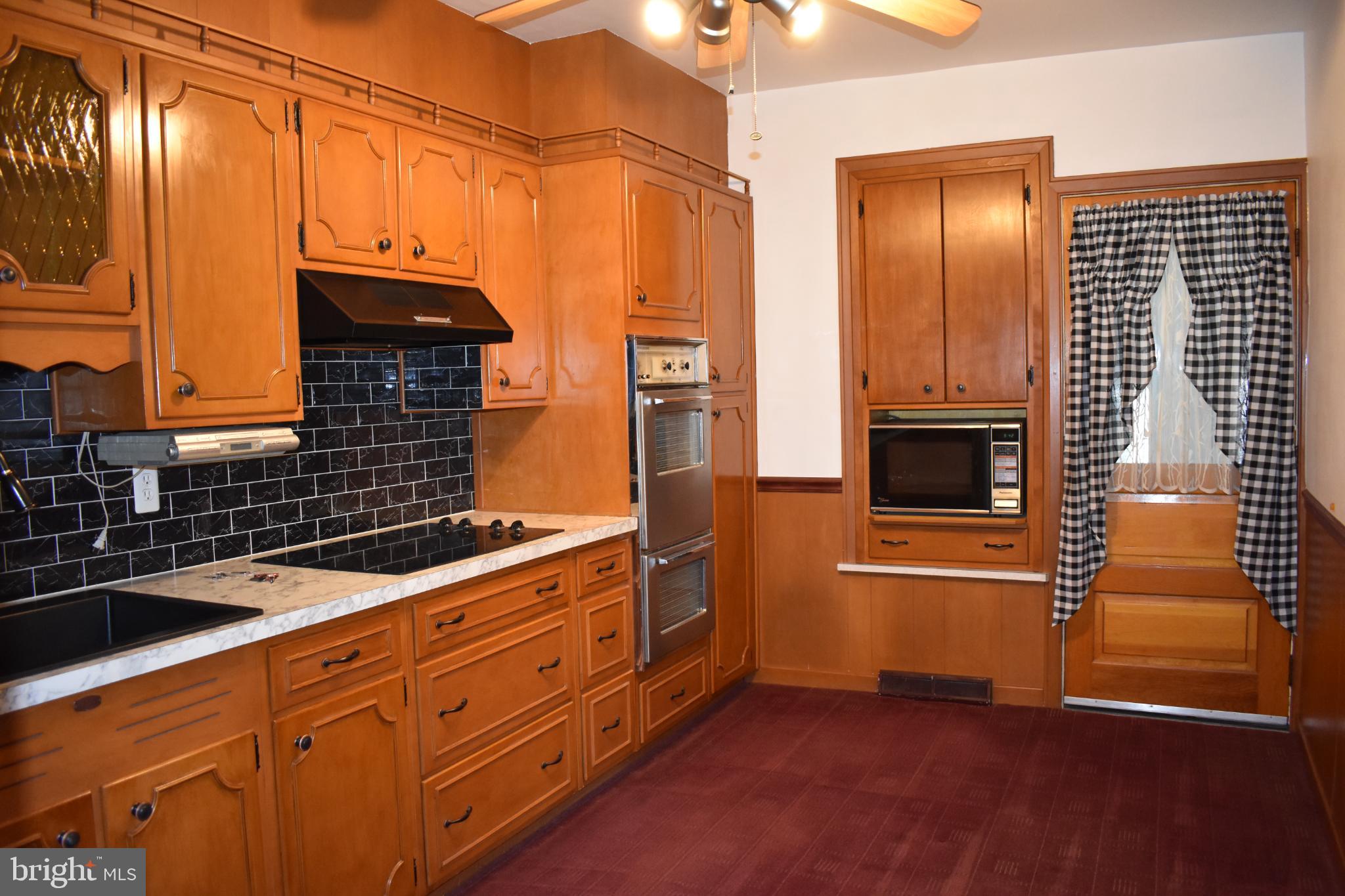 409 Walnut Street West Reading, PA 19611 - Photo 7 of 24 a kitchen with stainless steel appliances granite countertop a refrigerator and a stove