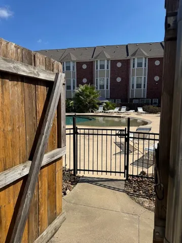 a view of a balcony with chairs