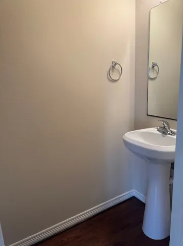 a bathroom with a sink and vanity