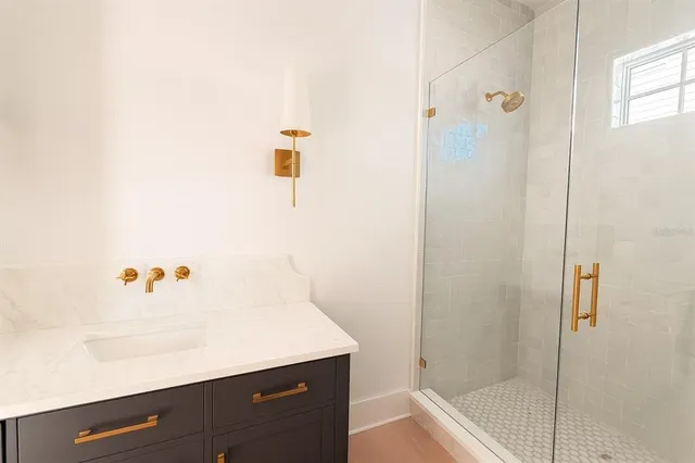 a view of a kitchen with a sink dishwasher and wooden floor