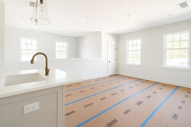 a large bathroom with a sink a mirror and a shower