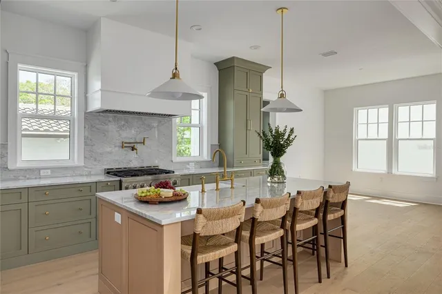 a kitchen with a table and chairs in it
