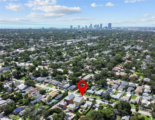 an aerial view of residential houses with outdoor space