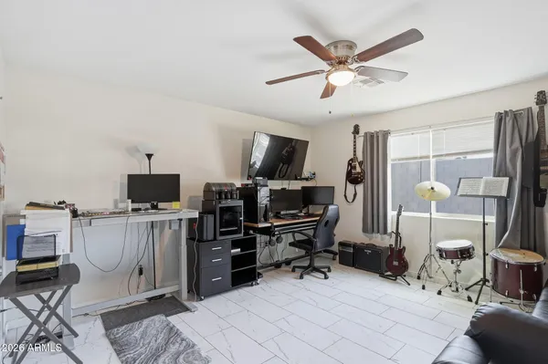 a living room with furniture a couch and dresser