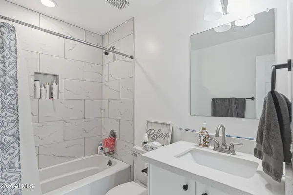 a front view of a house with swing