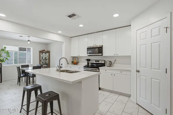 a dining room with furniture and window