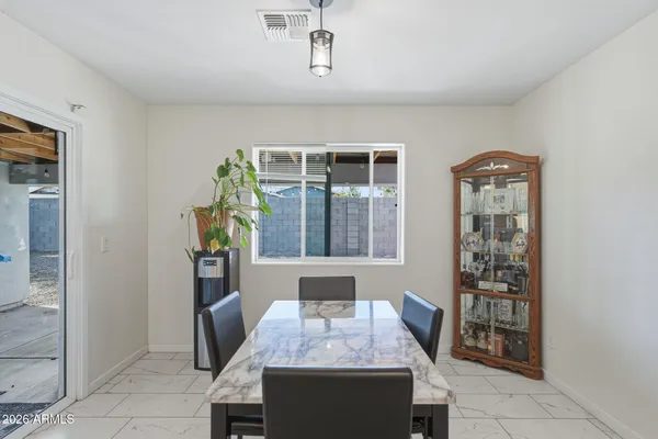 a view of a livingroom with furniture and a flat screen tv