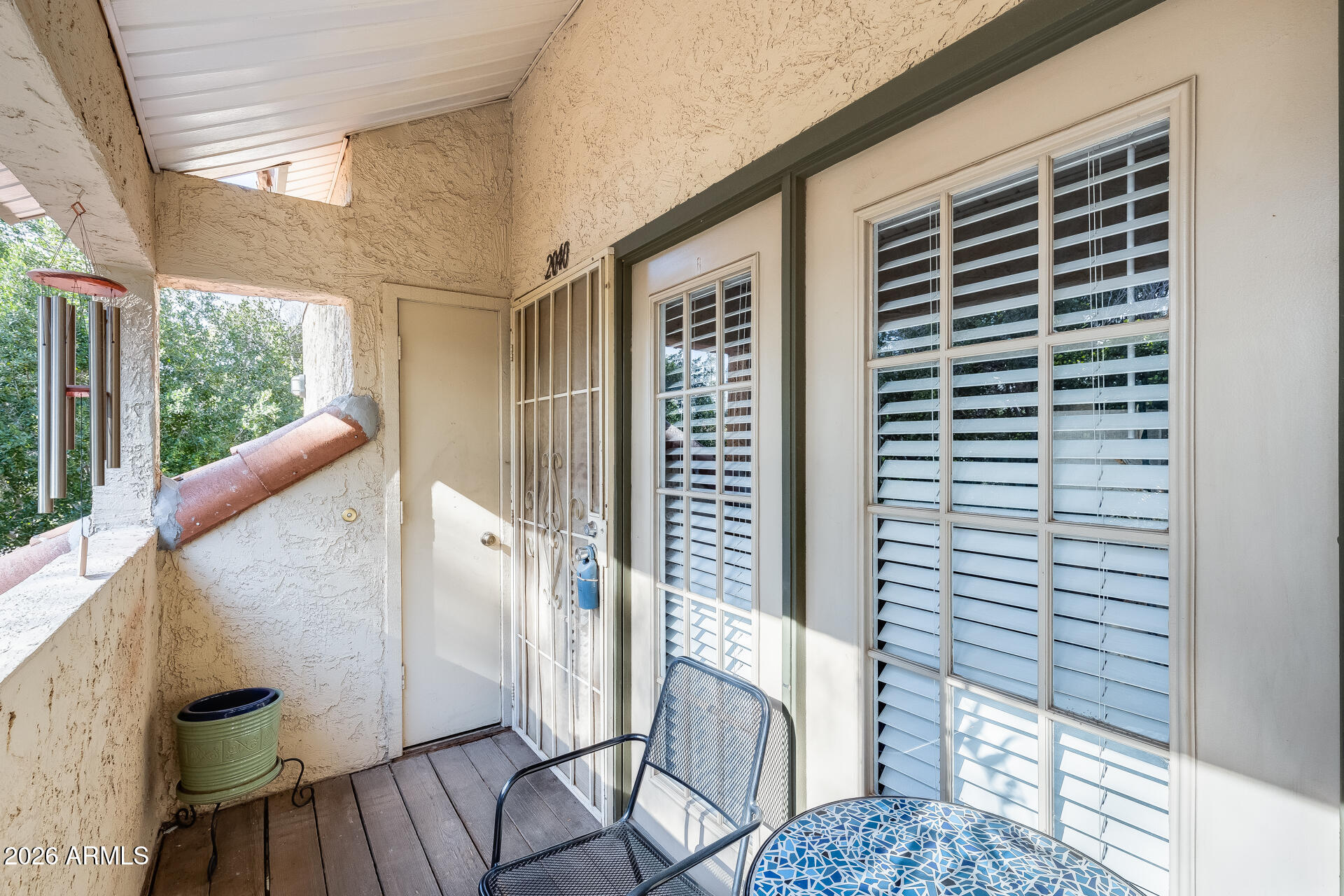 a view of balcony with a potted plant