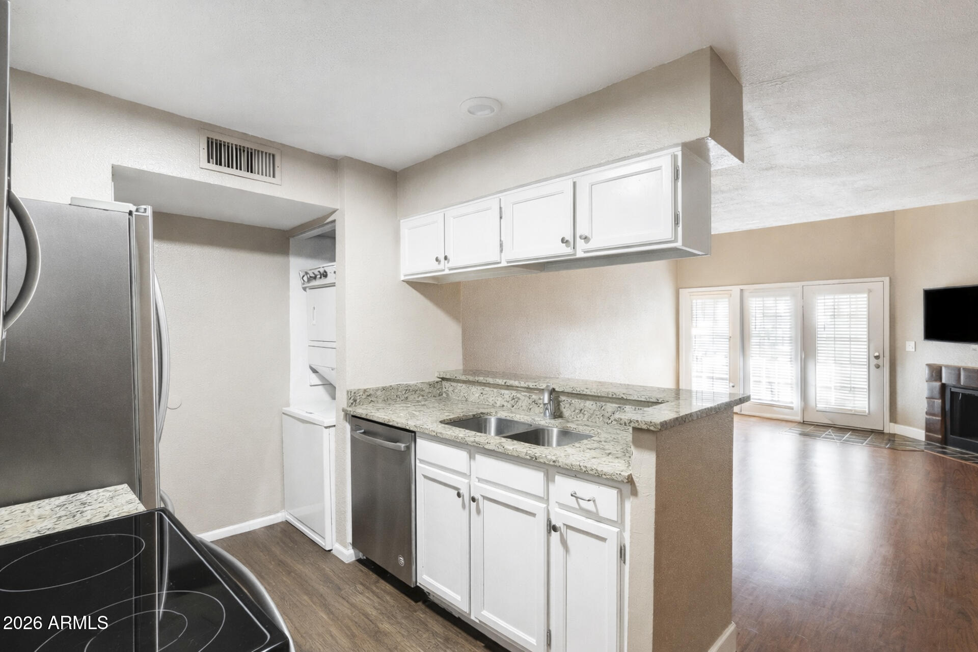 30 East Brown Road, Unit 2040 Mesa, AZ 85201 - Photo 12 of 23 a kitchen with stainless steel appliances granite countertop a sink and a stove