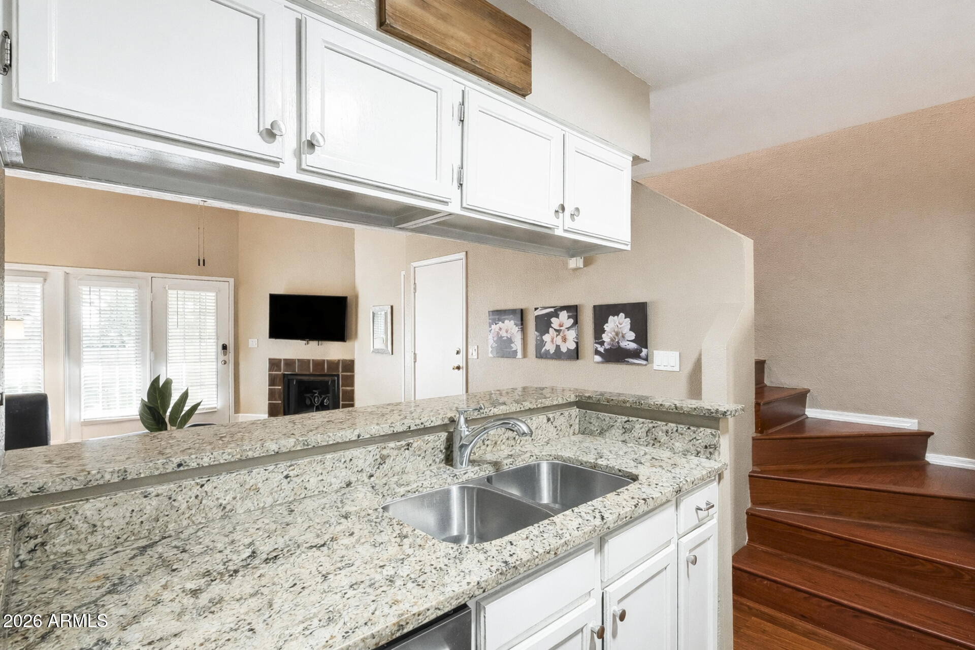 30 East Brown Road, Unit 2040 Mesa, AZ 85201 - Photo 13 of 23 a kitchen with stainless steel appliances granite countertop a sink and a microwave