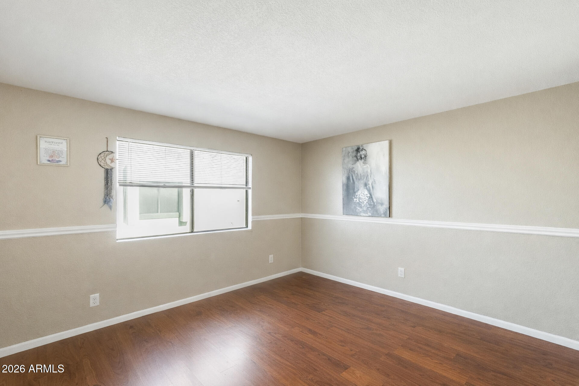 30 East Brown Road, Unit 2040 Mesa, AZ 85201 - Photo 14 of 23 an empty room with wooden floor and windows