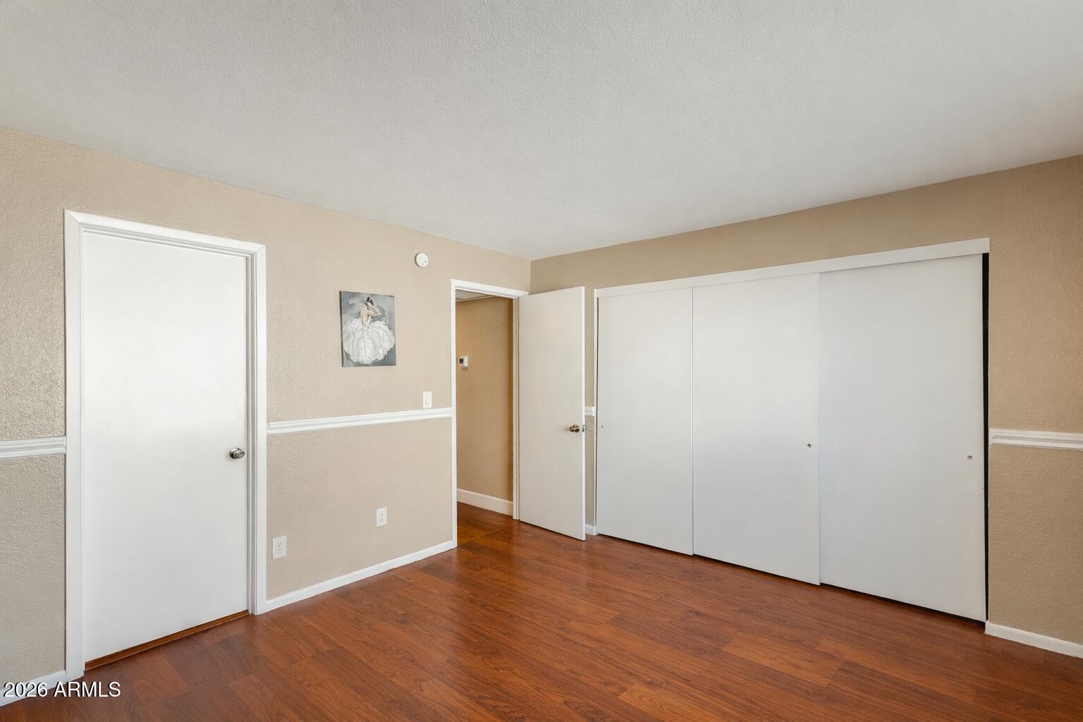 30 East Brown Road, Unit 2040 Mesa, AZ 85201 - Photo 15 of 23 an empty room with wooden floor
