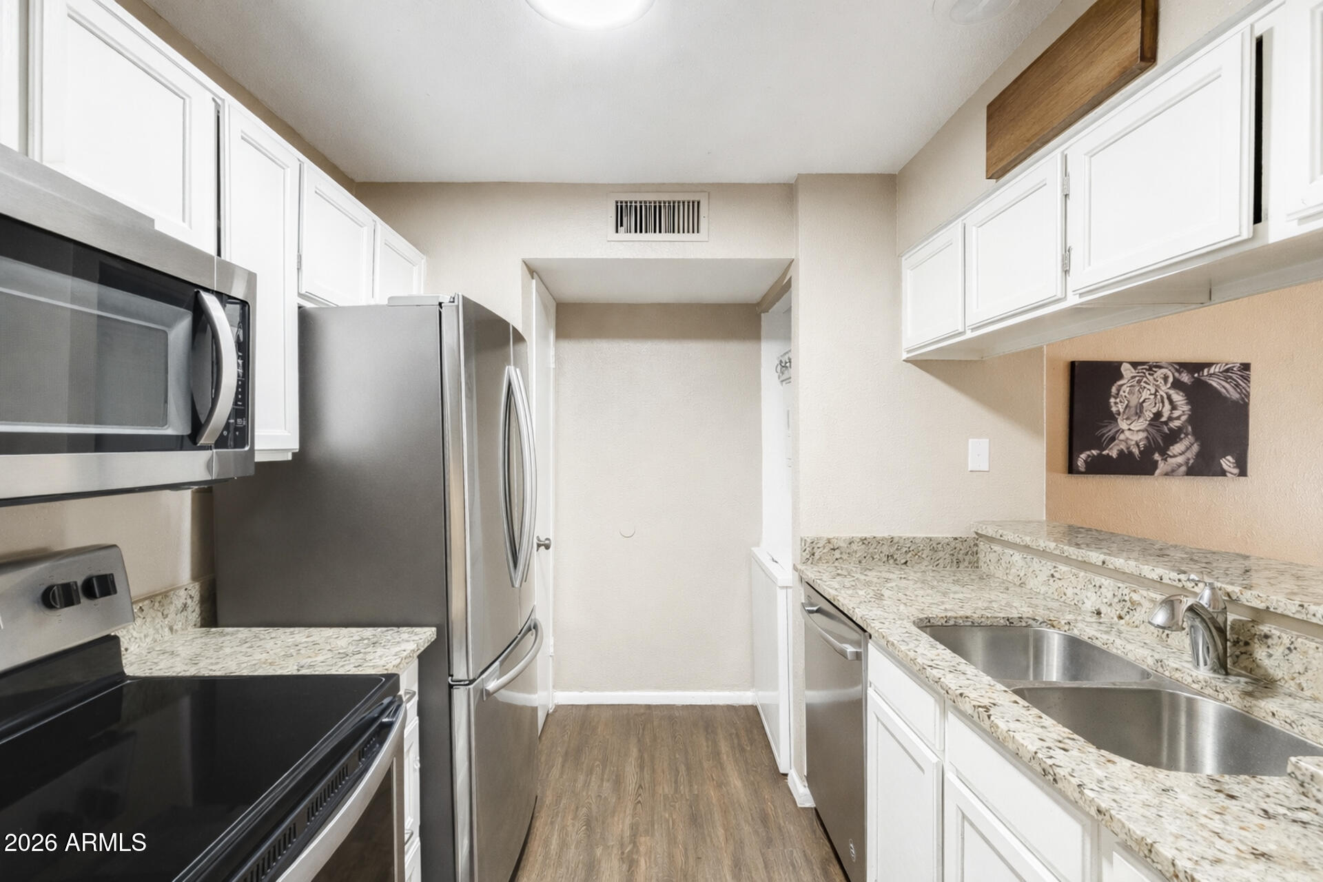30 East Brown Road, Unit 2040 Mesa, AZ 85201 - Photo 4 of 23 a kitchen with a sink stove and refrigerator
