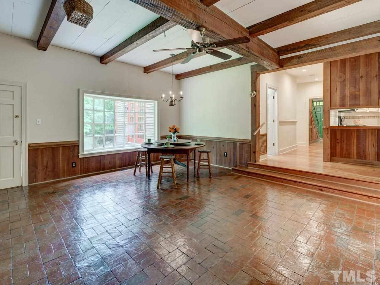 1100 Trail End Road Durham, NC 27712 - Photo 14 of 30 a dining room with furniture and wooden floor