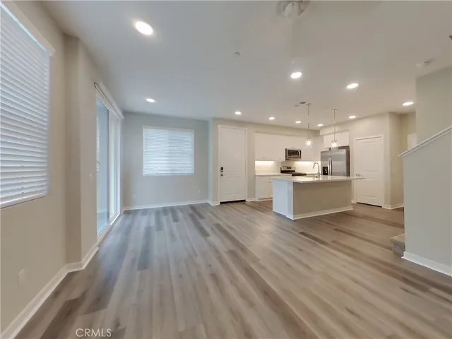 a view of kitchen with wooden floor