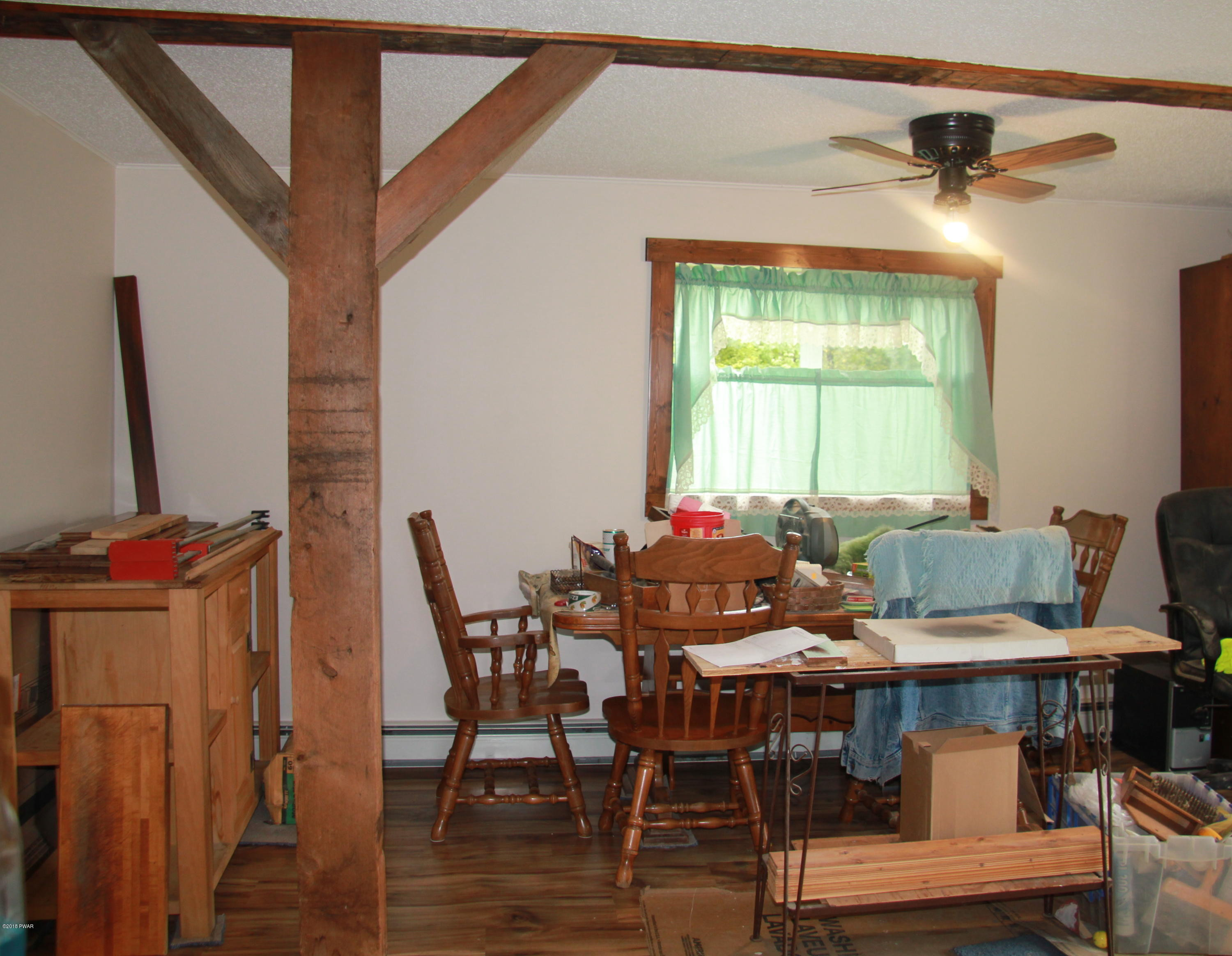 183 J J Road Moscow, PA 18444 - Photo 8 of 16 a view of a dining room with furniture and window