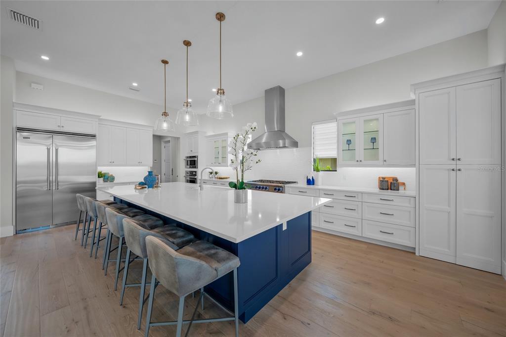 1109 Bayshore Road Nokomis, FL 34275 - Photo 11 of 63 a large kitchen with kitchen island a sink counter space and appliances