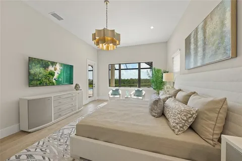 a spacious bathroom with a granite countertop tub mirror and vanity