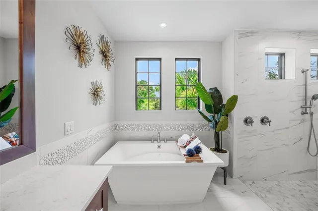 a bed room with a bed mirror and a window