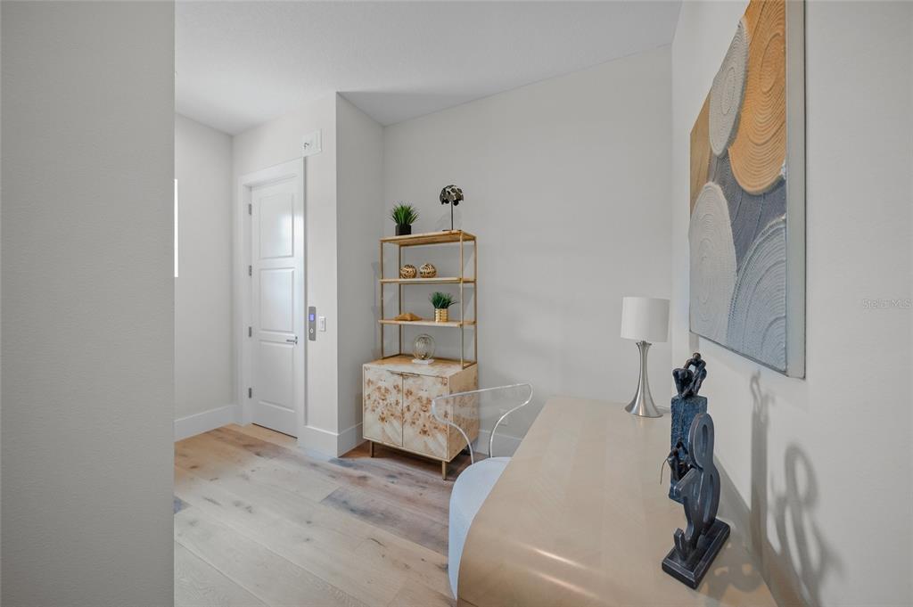 1109 Bayshore Road Nokomis, FL 34275 - Photo 25 of 63 a bedroom with a bed and a couch