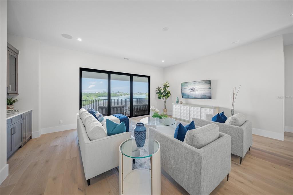 1109 Bayshore Road Nokomis, FL 34275 - Photo 27 of 63 a living room with furniture and a flat screen tv