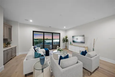 a view of a roof deck with furniture