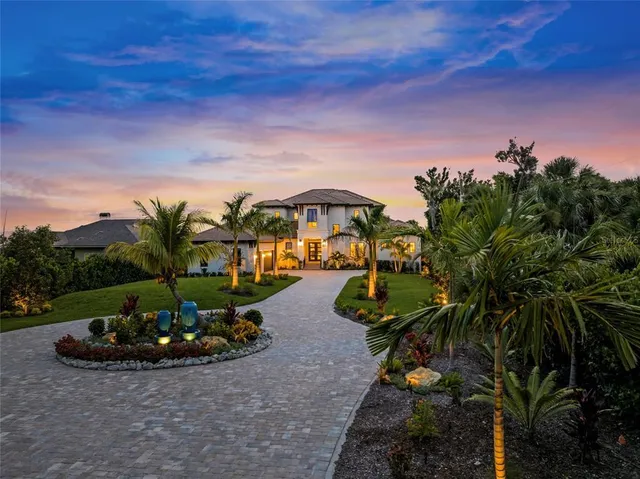 a view of a street with a car park fire pit and couches in the patio