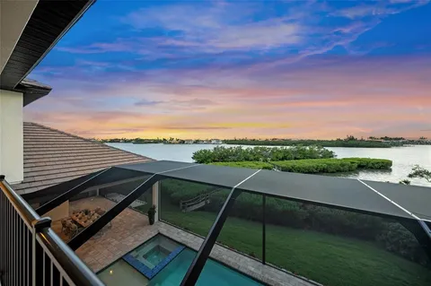 a view of a lake with a house in the background