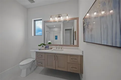 a view of a lake with houses in the back