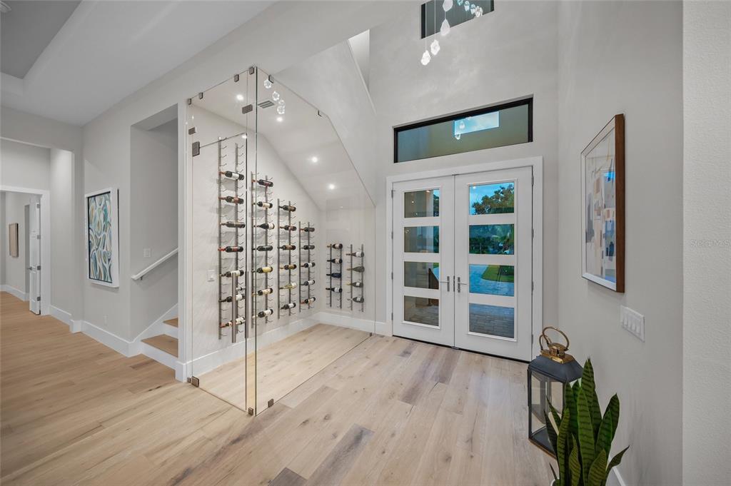 1109 Bayshore Road Nokomis, FL 34275 - Photo 4 of 63 a view of a hallway with wooden floor and entryway