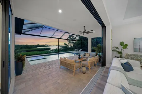an aerial view of a house with garden space and a patio