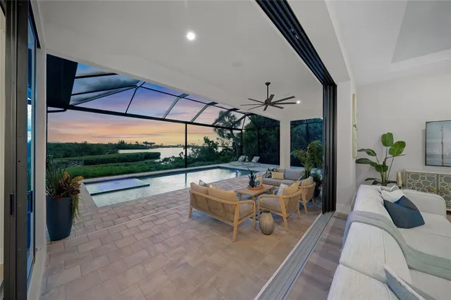 an aerial view of a house with garden space and a patio