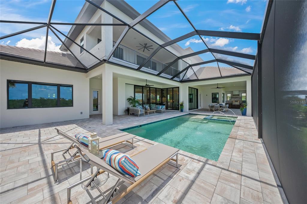 1109 Bayshore Road Nokomis, FL 34275 - Photo 47 of 63 a view of a porch with furniture and a yard