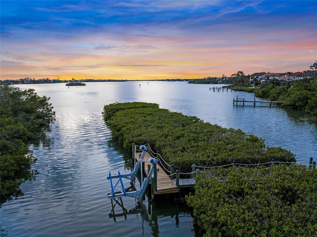 1109 Bayshore Road Nokomis, FL 34275 - Photo 51 of 63 a view of a lake with a house in the background