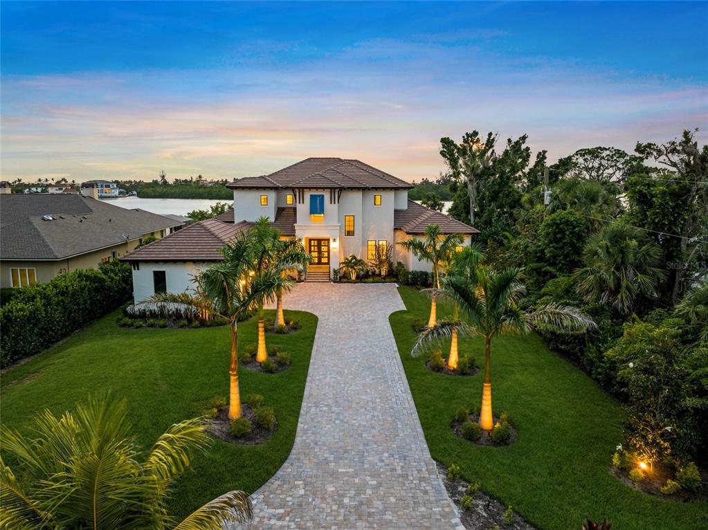 1109 Bayshore Road Nokomis, FL 34275 - Photo 54 of 63 an aerial view of a house with garden space and a patio