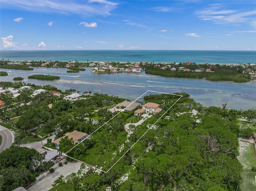 1109 Bayshore Road Nokomis, FL 34275 - Photo 58 of 63 a view of a lake with houses in the back
