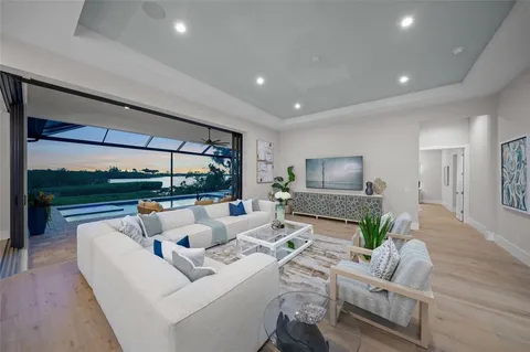 a large kitchen with a table and chairs
