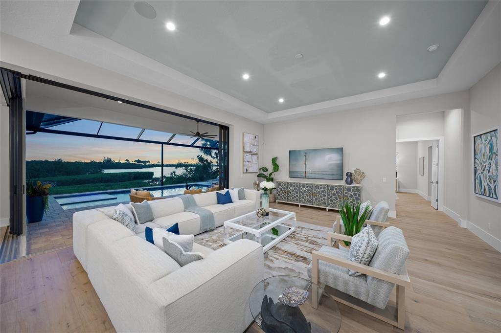 1109 Bayshore Road Nokomis, FL 34275 - Photo 9 of 63 a living room with furniture and a large window