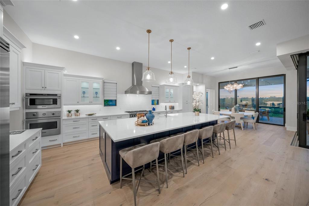 1109 Bayshore Road Nokomis, FL 34275 - Photo 10 of 63 a large kitchen with a table and chairs