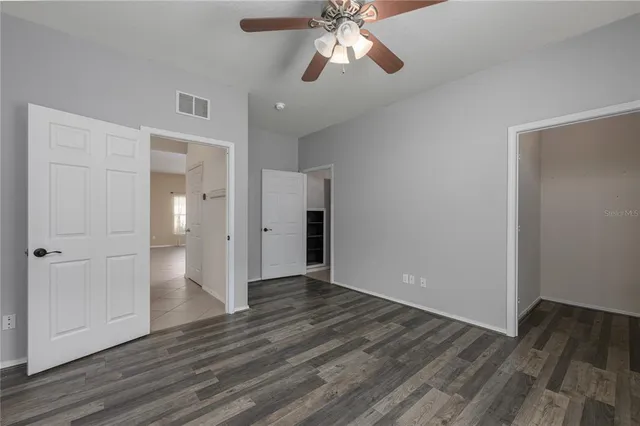 a view of an empty room and wooden floor