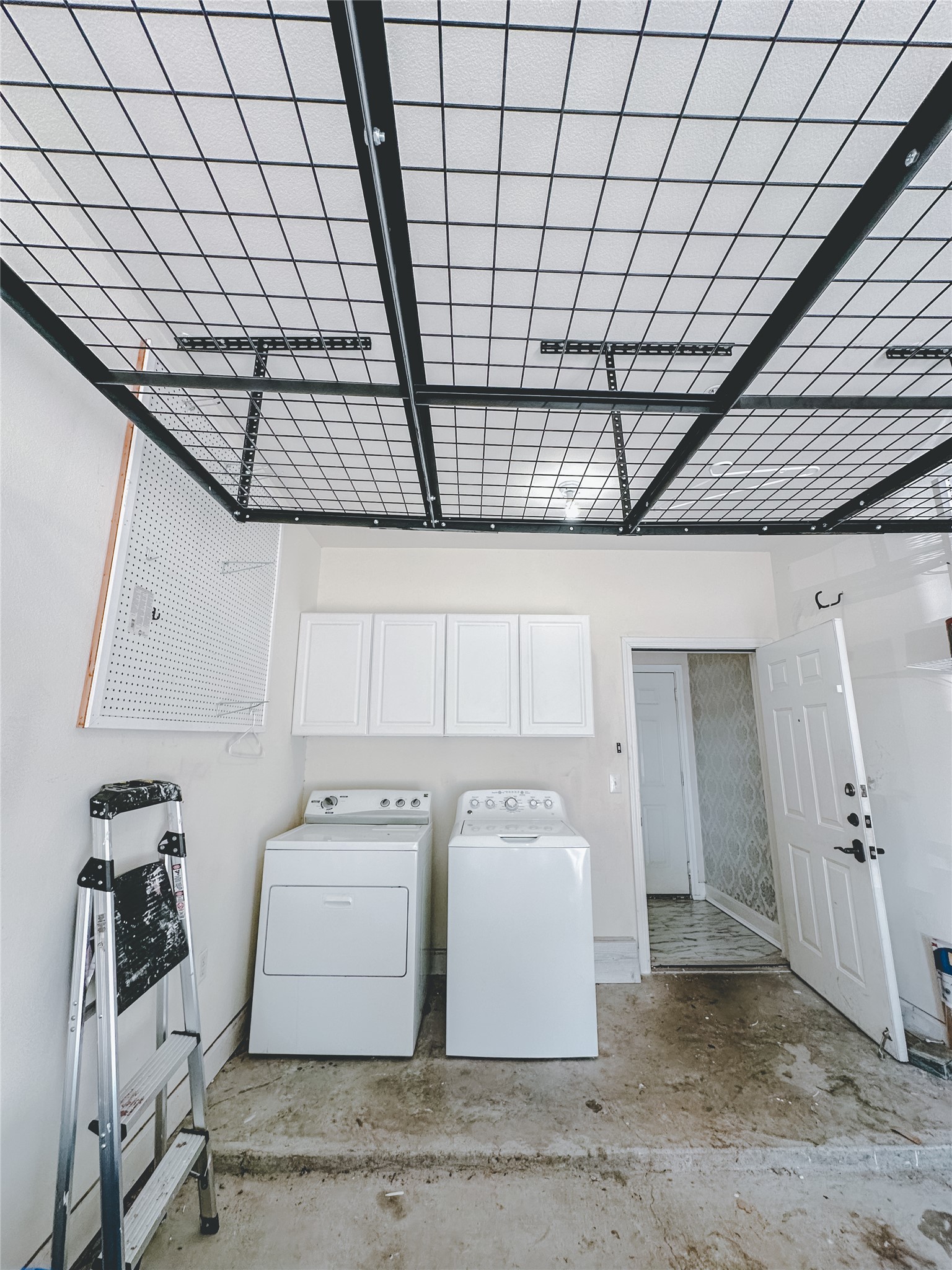 7701 Rialto Boulevard, Unit 1122 Austin, TX 78735 - Photo 24 of 24 Laundry in one car garage with additional storage