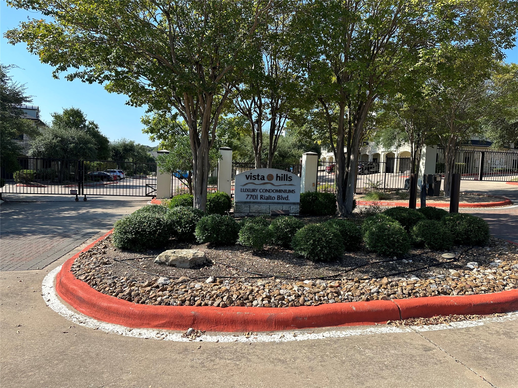 7701 Rialto Boulevard, Unit 1122 Austin, TX 78735 - Photo 3 of 24 Gated community entrance