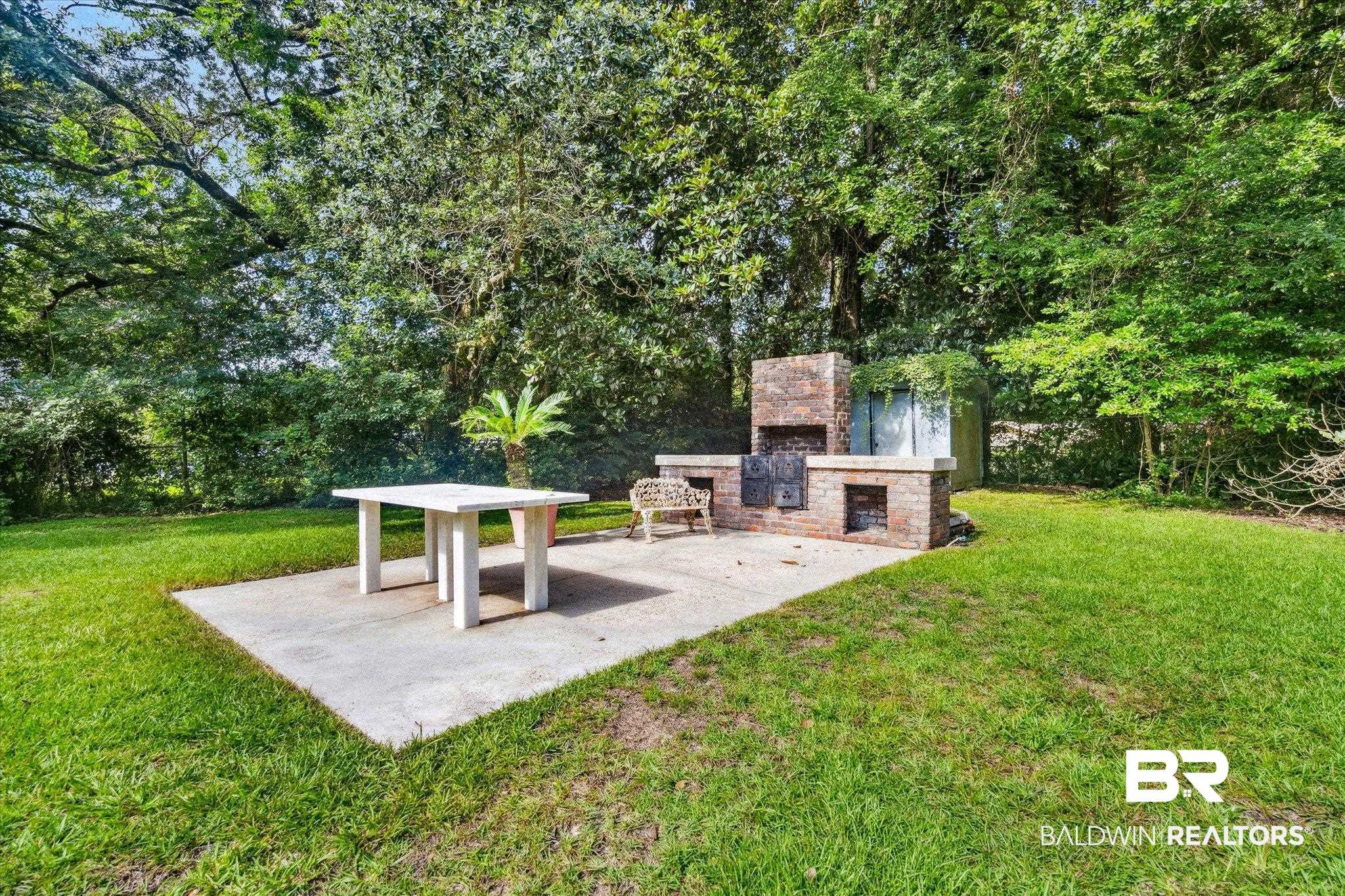 1252 Helm Circle Mobile, AL 36693 - Photo 17 of 18 View of yard featuring an outdoor stone fireplace
