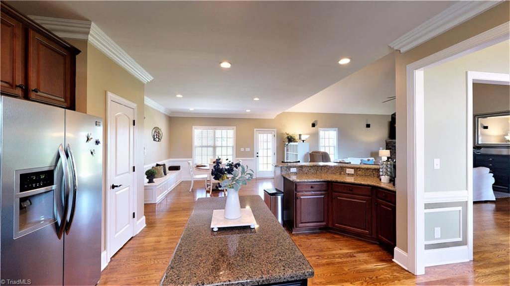 8887 Rymack Drive Oak Ridge, NC 27310 - Photo 14 of 30 Kitchen into breakfast area