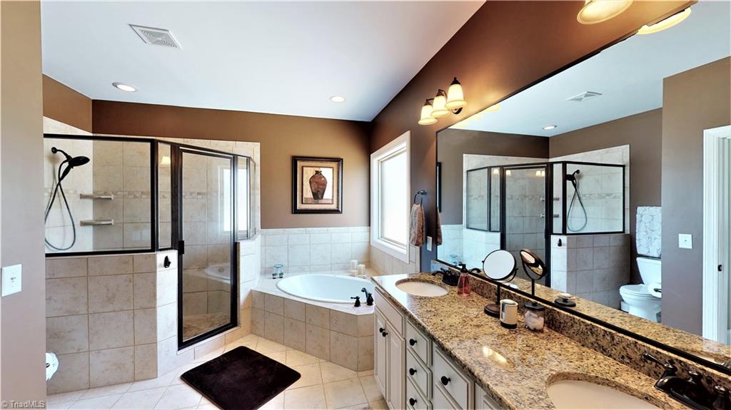 8887 Rymack Drive Oak Ridge, NC 27310 - Photo 17 of 30 Master bathroom
