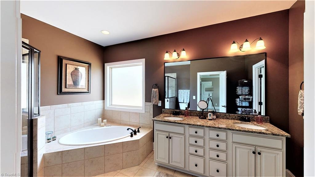 8887 Rymack Drive Oak Ridge, NC 27310 - Photo 18 of 30 Master bathroom